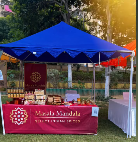 Masala Mandala stall with spice packs laid out at an outdoor market